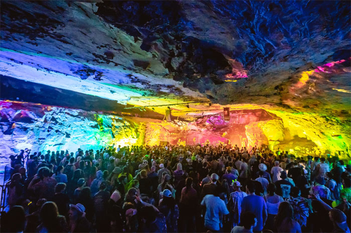 People gathered inside a concert venue built in an actual cave