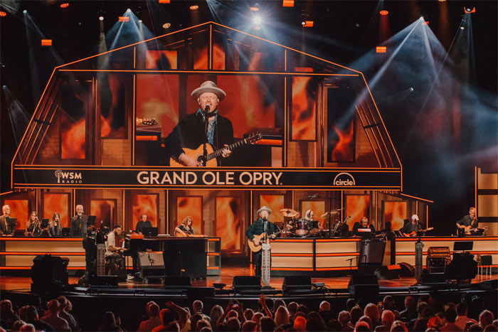 Jordan St. Cyr performing on stage at the Grand Ole Opry